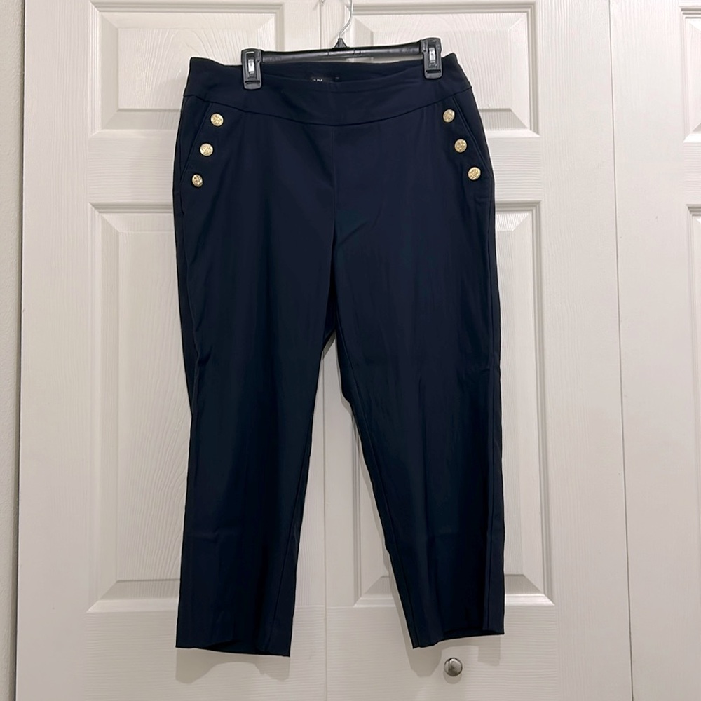 Navy pants with gold accent buttons